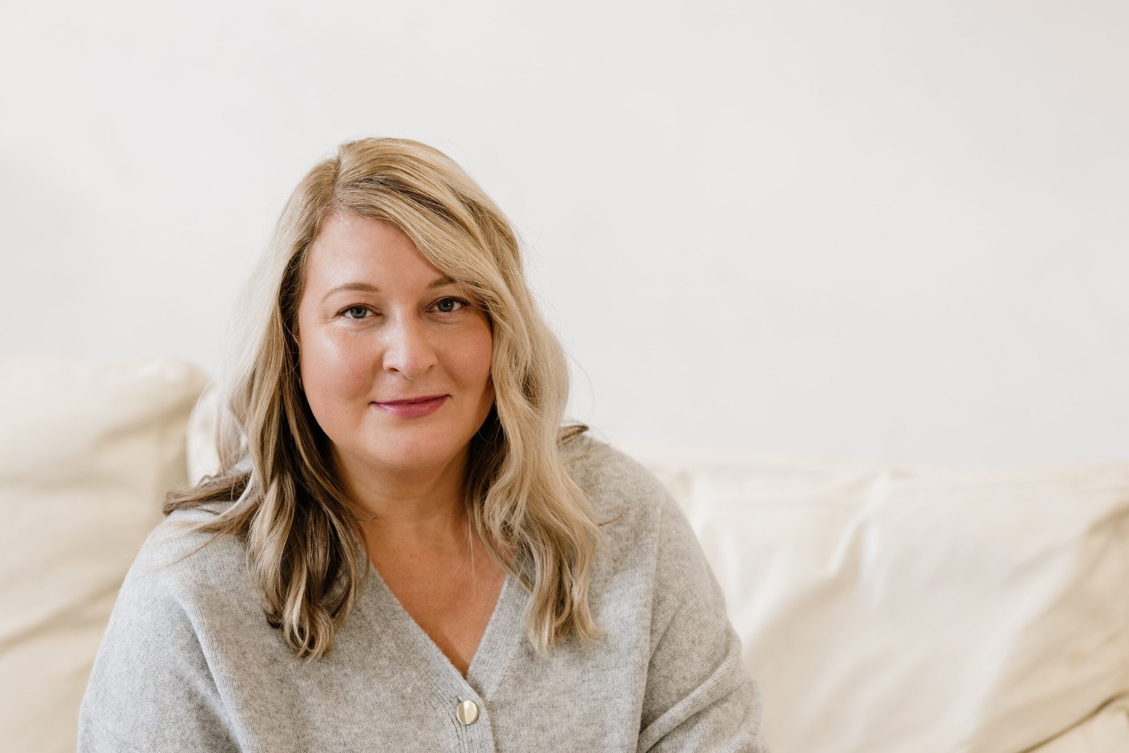 Georgina Hall, coaching psychologist sits looking at straight ahead