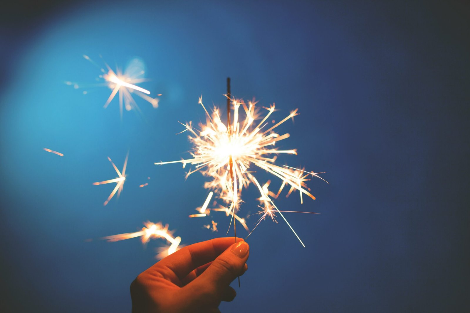 Hand holding a sparkler